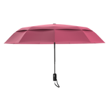 An image of the profile view of a pink colored, open travel Repel umbrella.