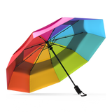 The Rainbow Top Best-Selling Windproof Compact Travel Umbrella is pictured on it's own, open and leaning to the left. 